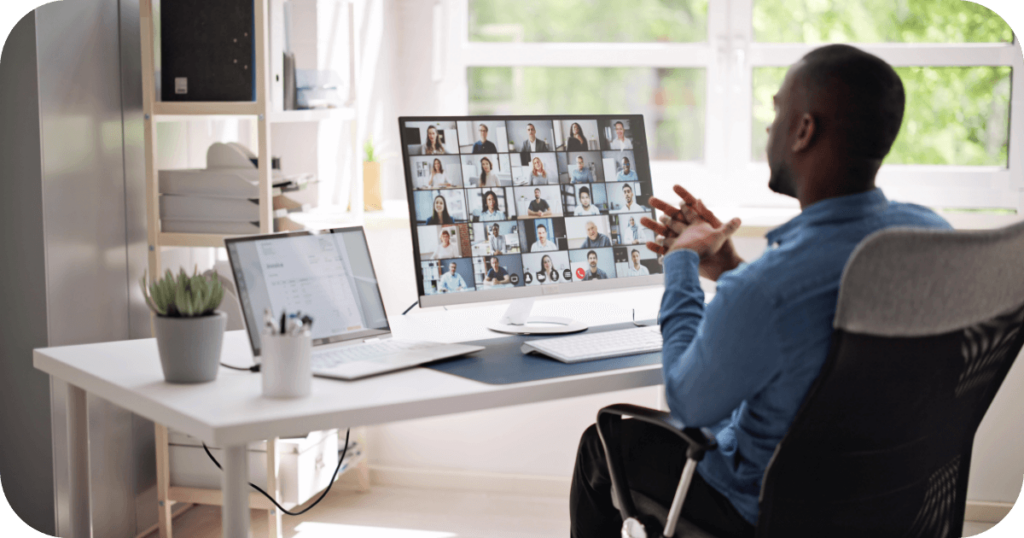 A remote worker participating in a virtual meeting with multiple team members on screen, showcasing the significance of remote team management in seamless collaboration.